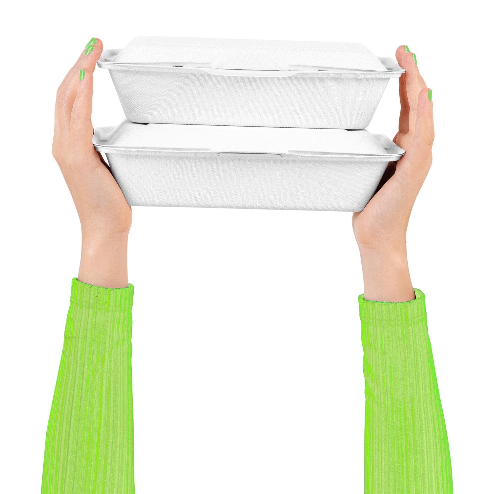 Staff packing a meal kit in studio